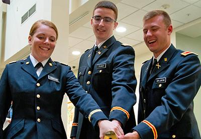 Three ROTC students at commissioning ceremonies